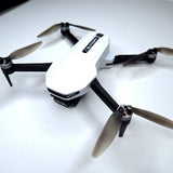 White quadcopter drone with four propellers