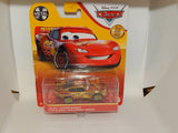 Gold metal die-cast Lightning McQueen toy car in retail blister pack