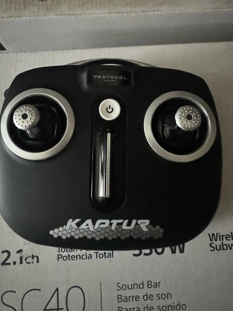 Drone remote controller with joystick, circular control ports, and power button