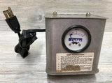 Vintage metal battery charger with ammeter gauge and instruction label, with power plug cable