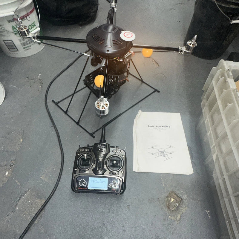 Quadcopter controller and quadcopter on stand with instruction manual