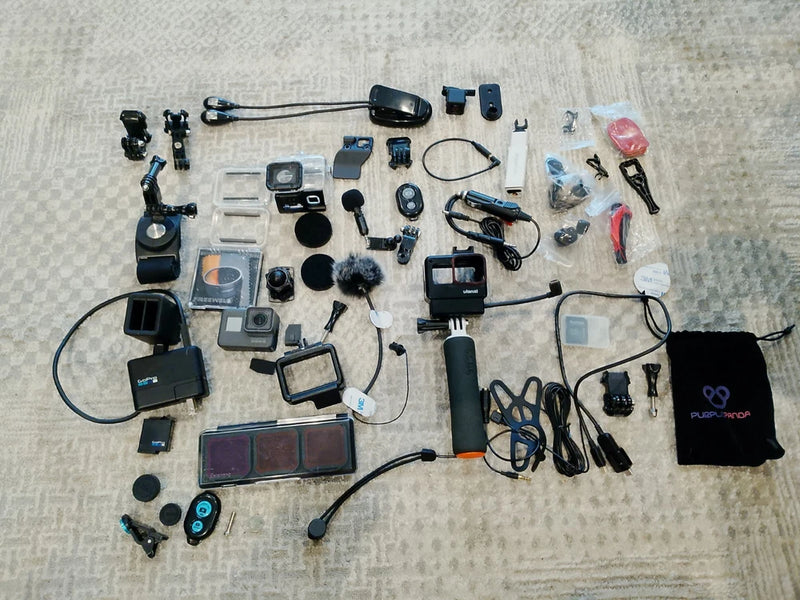 GoPro HERO5 action camera bundle with mounts, cables, batteries, and accessories kit