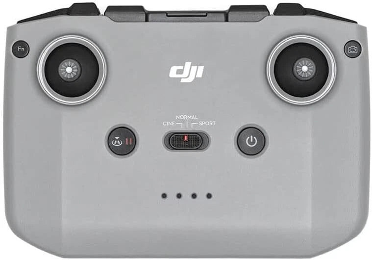DJI drone controller with twin thumb wheels and central screen buttons, gray