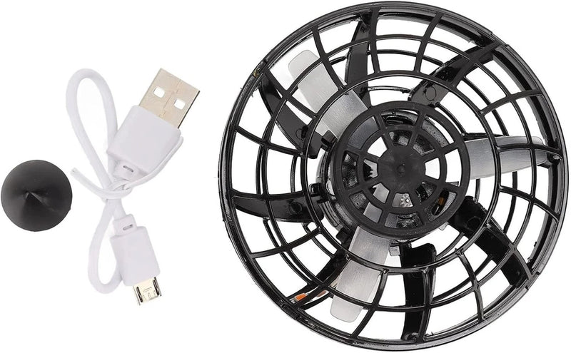 Black flying orb drone toy with protective cage and USB charging cable