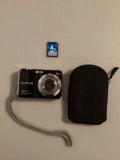 Fujifilm FinePix black compact digital camera with lens, wrist strap, case, and 4GB card