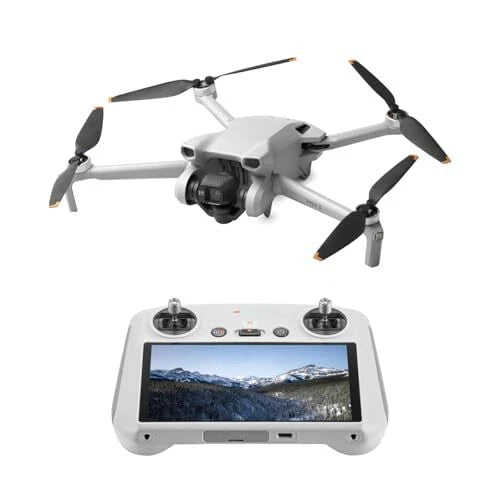 White quadcopter drone with camera and propellers, paired with gray remote controller
