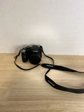 Black Fujifilm Finepix digital camera with attached neck strap