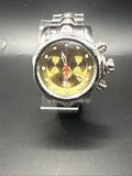 Silver wristwatch with red hands and gold dial, black strap