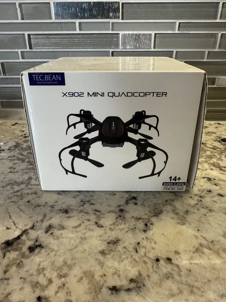 TEC.BEAN X902 mini quadcopter drone box, black spider-style drone illustration