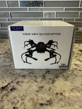 TEC.BEAN X902 mini quadcopter drone box, black spider-style drone illustration