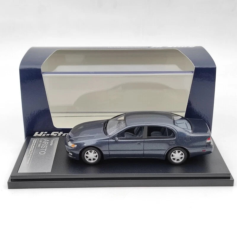 1:43 resin model car of a blue sedan in display case