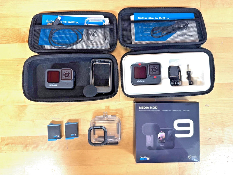 Action camera bundle with two cameras in open case and clear accessory housing