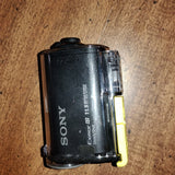 Sony action camera in clear housing with yellow latch, black body