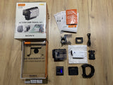 Action cam live-view remote kit with camera, remote, mounts, case, and accessories