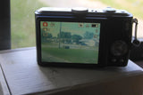 Panasonic LUMIX DMC-TZ5 Digital Camera & Battery- Broken Battery Door but WORKS
