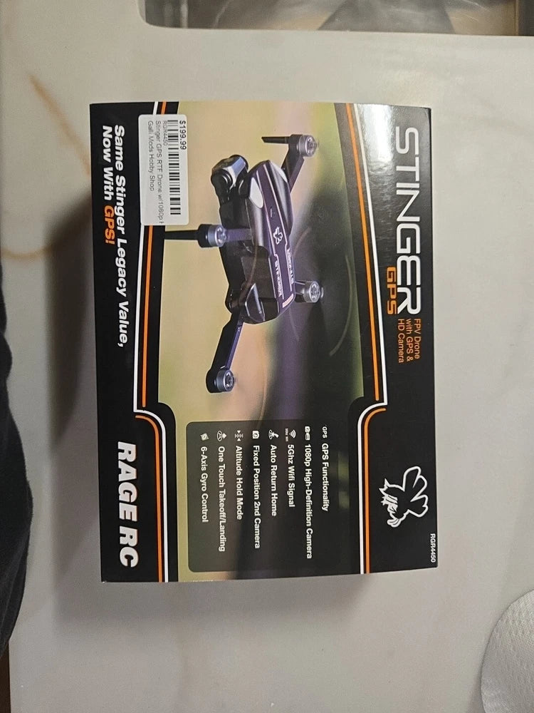 FPV drone retail box packaging, purple and black with illustrated drone and features