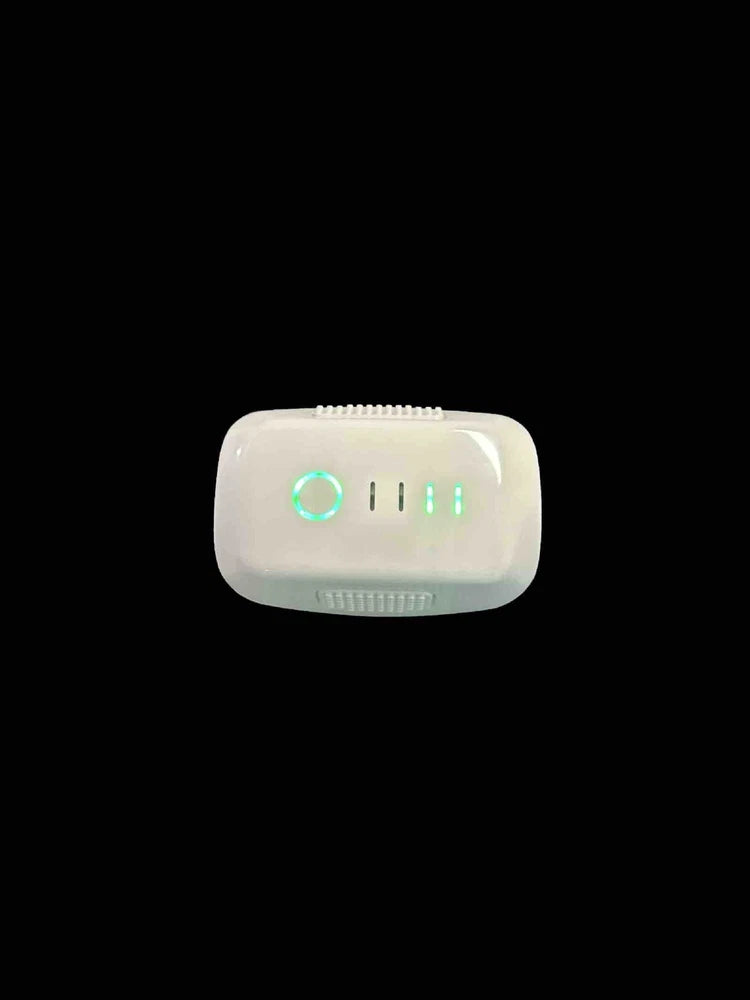 White drone battery pack with blue-green LED status indicators
