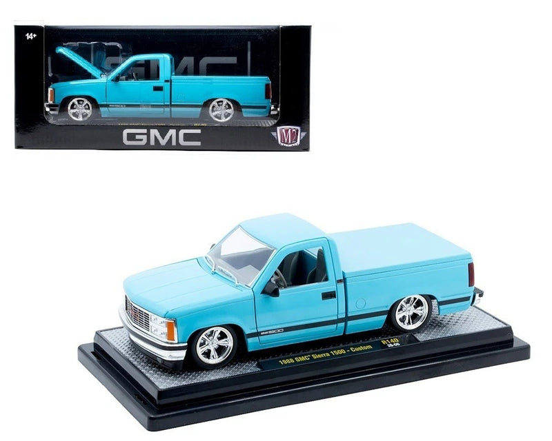 1:24 light blue GMC Sierra 1500 die-cast model truck with chrome wheels