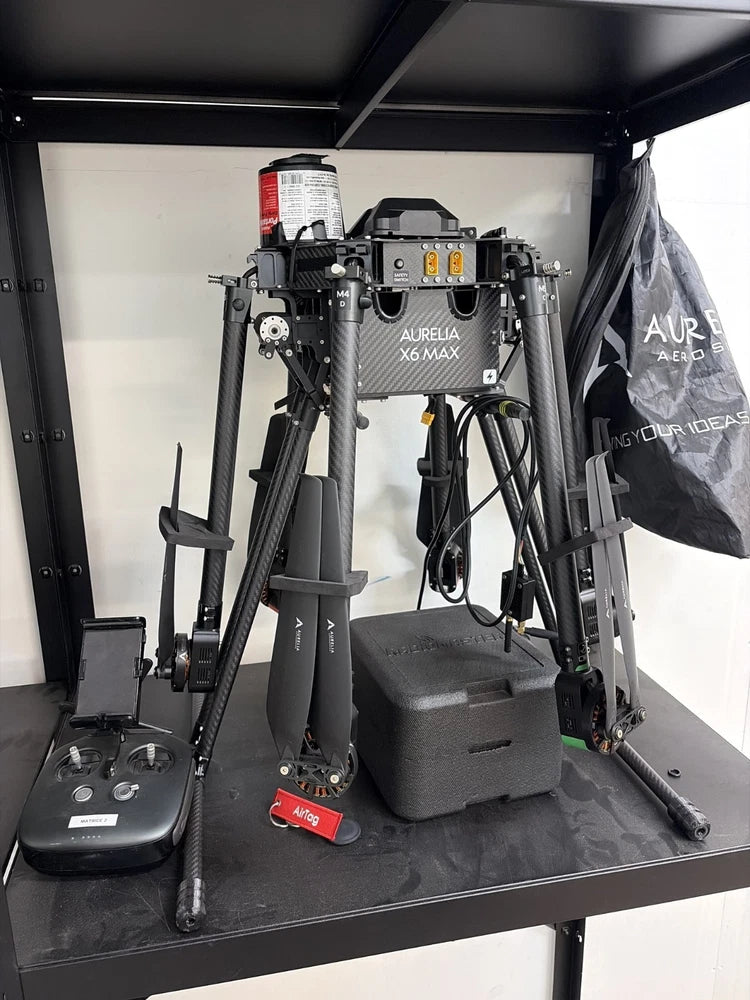 Hexacopter drone with six arms and motors, mounted in open equipment case