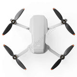 DJI Mini 2 drone quadcopter with four propellers and gray body