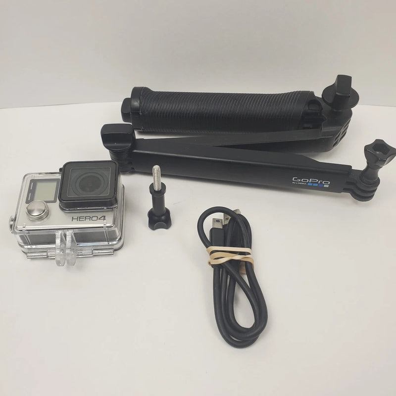GoPro HERO4 action camera kit with clear case, black handle mount, and cables