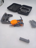 Orange quadcopter drone with gray arms, exposed body and included storage case