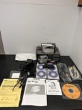 Silver DVD camcorder with accessories, cables, manuals, and two discs