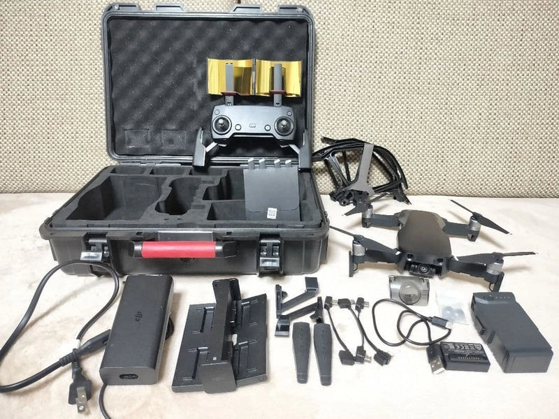 Waterproof hard case with foam inserts and drone accessories, open