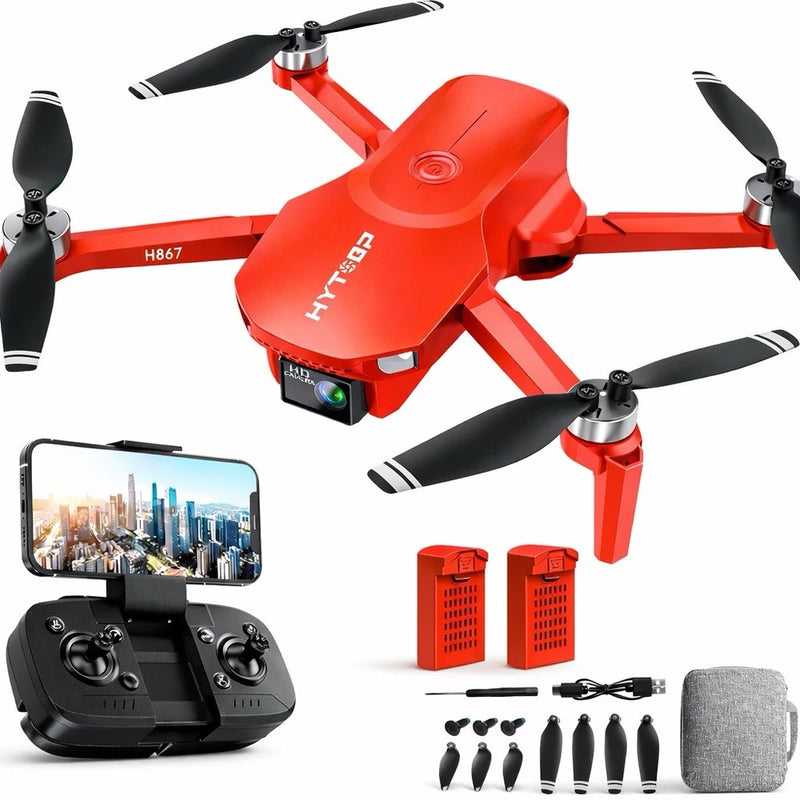 Red foldable RC quadcopter drone with camera, remote controller and accessories shown