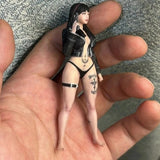Black resin miniature figure in lingerie with choker and thigh straps