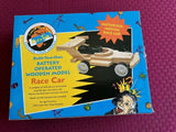 Kid's battery-operated wooden model race car kit in retail box