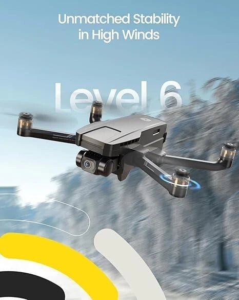 Gray quadcopter drone with camera and propellers, angled view in flight