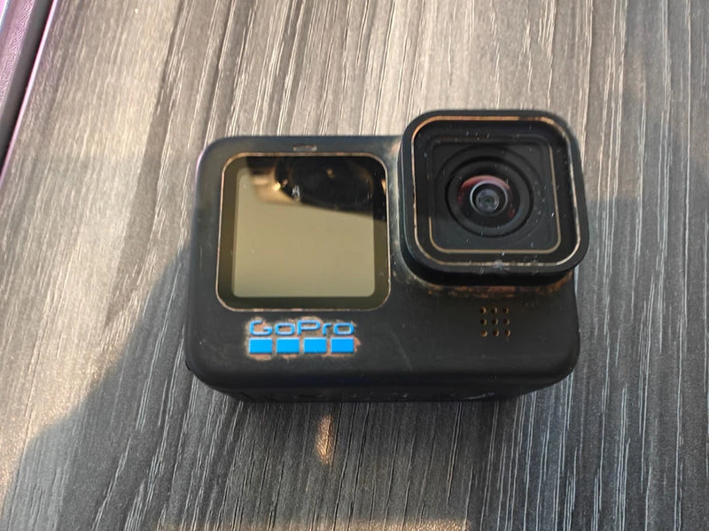GoPro HERO10 Black action camera front with lens and LCD screen, parts only
