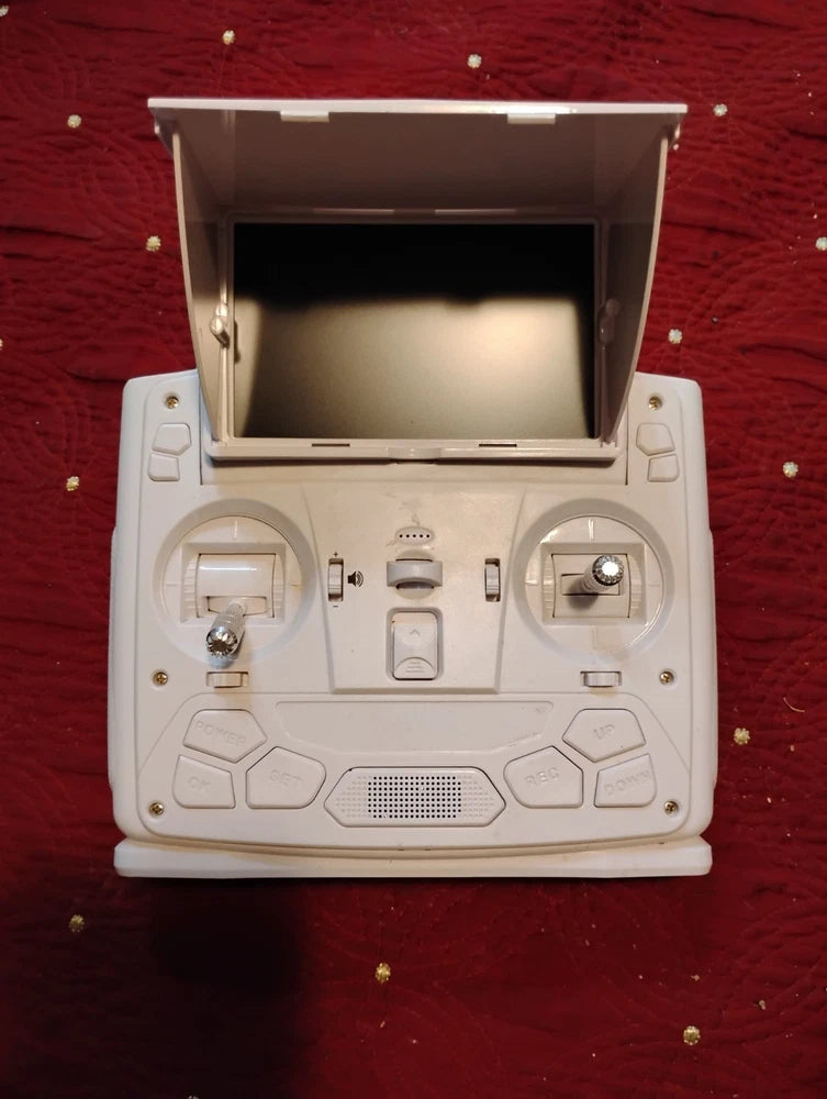White drone transmitter with twin control sticks and central display panel