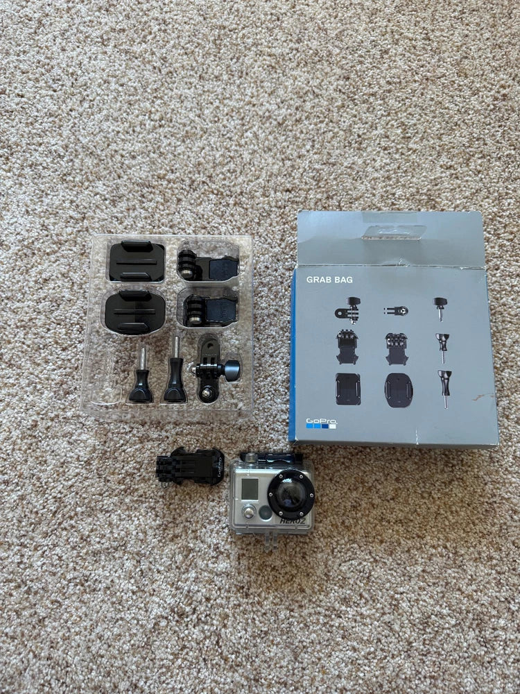 GoPro HERO2 action camera with waterproof case and mounting parts, for repair