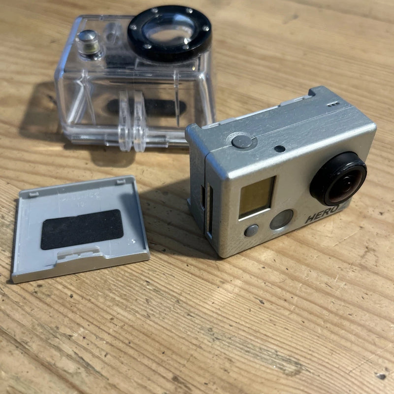 GoPro HERO2 action camera in clear housing with side lens and mounting plate