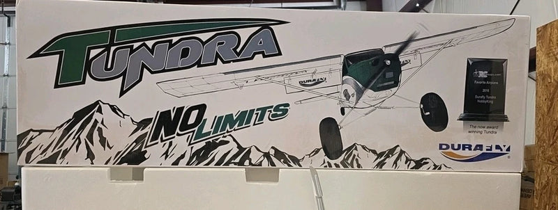 RC airplane kit box with green Tundra logo and mountain graphic