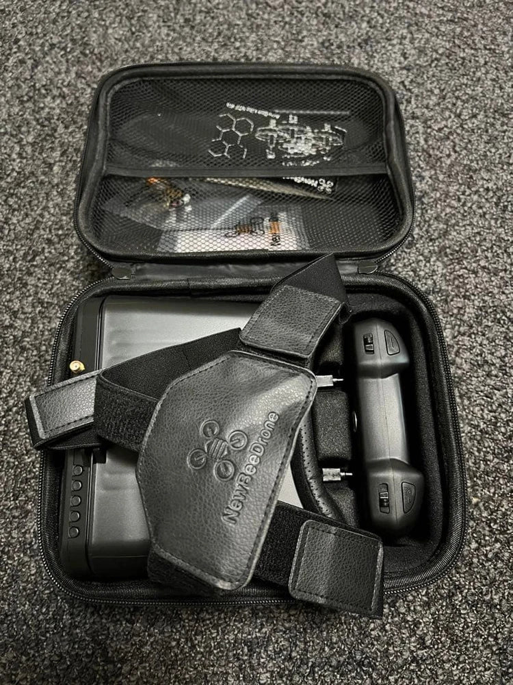 Micro FPV drone quadcopter with accessories in black zippered carrying case