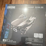 Black quadcopter drone with dual camera on retail box