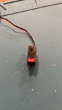 Nano RC servo motor with attached wiring and mounting bracket