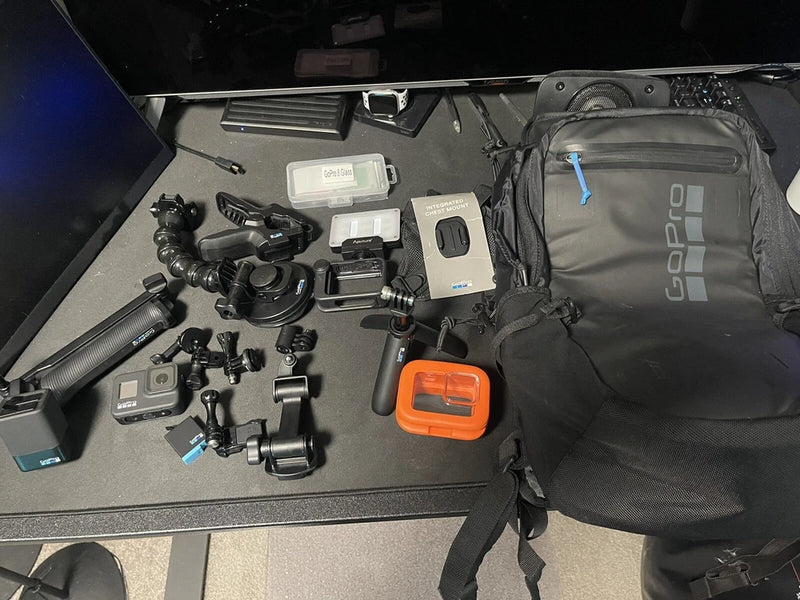 GoPro camera bag with black action-camera accessories and mounts laid out