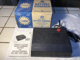 Black General Electric nickel-cadmium battery charger with power cord and instruction insert