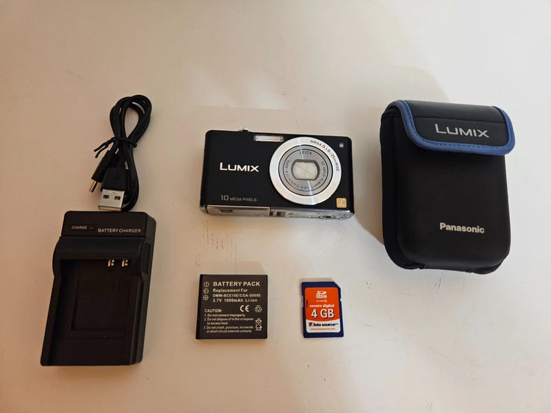 Black Panasonic Lumix compact camera with lens and accessories set