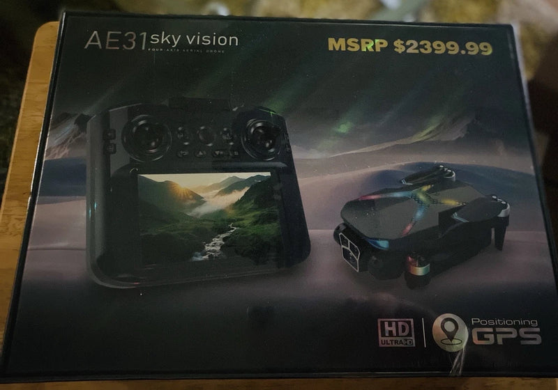 Four-axis aerial drone retail box with drone and controller shown