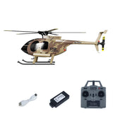 Beige RC helicopter model with skids and tail rotor, plus remote controller and battery