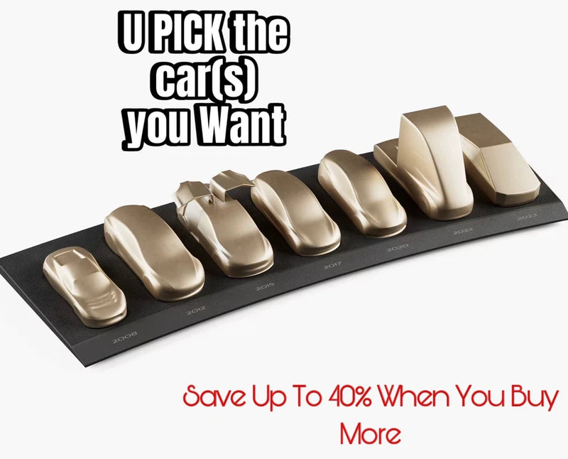 Set of metallic car model badges on a black display base