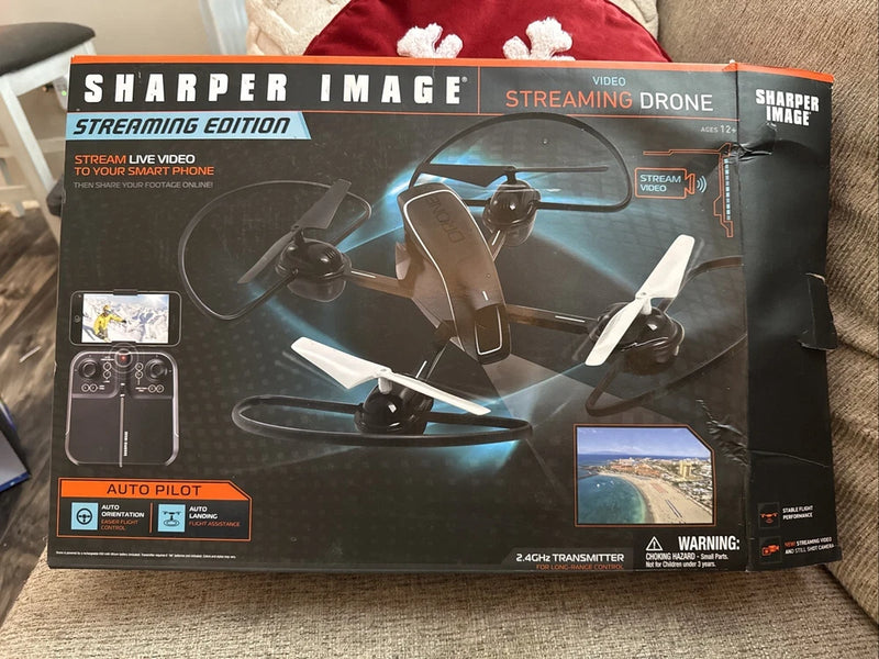 Video streaming drone retail box showing quadcopter with LED lights and auto pilot