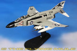 1:72 F-4J Phantom II model jet with US Navy markings on display stand