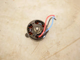 Electric drone motor, round stator with red and blue wires and copper windings