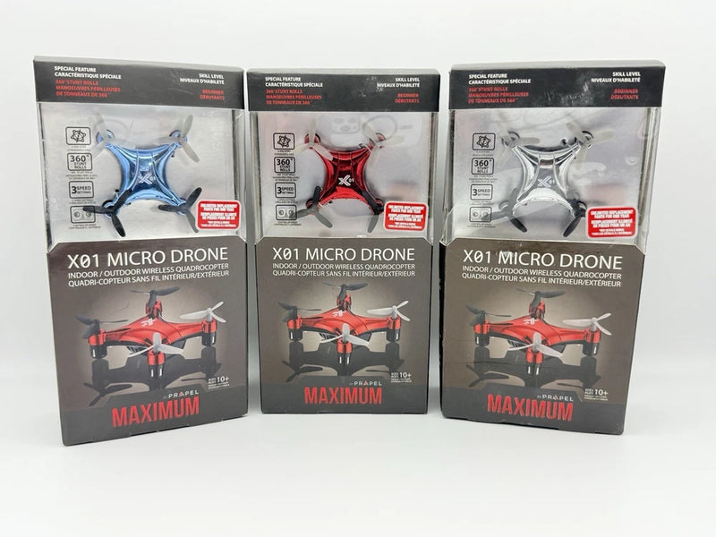 Three micro drone retail boxes with quadcopter in blue, red, and white